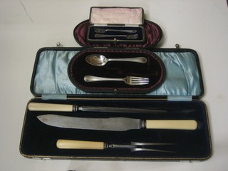 A pair of silver plated forks, a part silver plated christening set and a 3 piece steel carving set, cased
