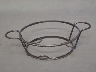A circular silver plated twin handled dish frame
