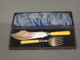 A pair of silver plated fish servers cased
