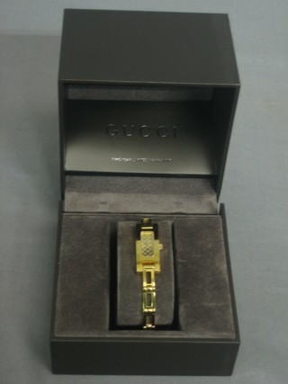 A lady's Gucci wristwatch contained in a gold plated case