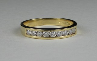 A lady's 18ct yellow gold half eternity ring set diamonds