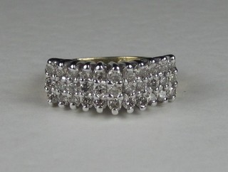 A lady's 14ct gold dress ring set 3 rows of numerous diamonds