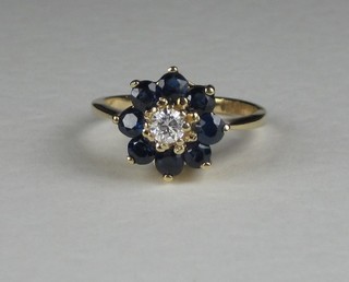 A 14ct yellow gold cluster dress ring set sapphires