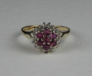 A 9ct yellow gold cluster dress ring set rubies and small diamonds