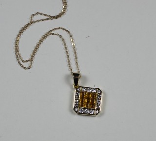 An 18ct yellow gold pendant set diamonds and a citrene, hung on a fine gold chain