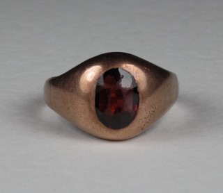 A 9ct gold dress ring set a cabouchon cut red stone