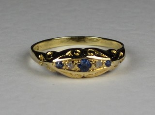 An 18ct yellow gold dress ring set sapphires and diamonds