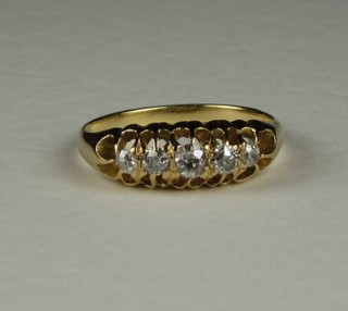 A lady's gold dress ring set 5 diamonds
