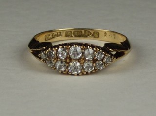 A lady's 18ct gold marquise shaped dress ring set 12 diamonds