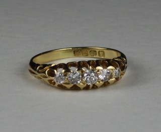 An 18ct gold dress ring set 5 diamonds