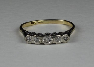 An 18ct gold dress ring set 5 illusion set diamonds