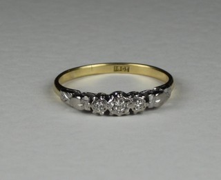A lady's 18ct gold dress ring set illusion set diamonds