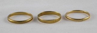 2, 22ct gold wedding bands (1 cut) and a 9ct gold wedding band