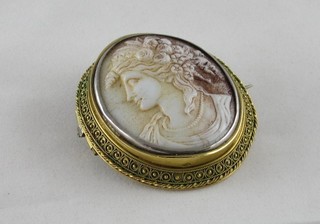 A shell carved cameo brooch contained in a gilt metal mount