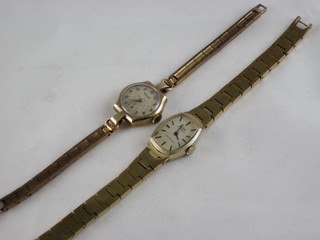 A lady's Rotary wristwatch contained in a gold case and 1 other wristwatch