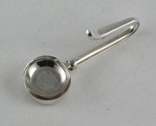 A modern silver napkin clip