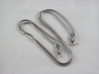 A modern silver double snake necklace
