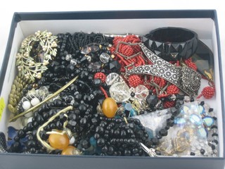 A box containing a collection of costume jewellery
