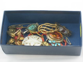 A pierced mother of pearl brooch, a gilt metal brooch and a small collection of costume jewellery
