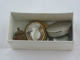 4 carved shell cameo brooches, a plated sovereign case and a "silver" pill box
