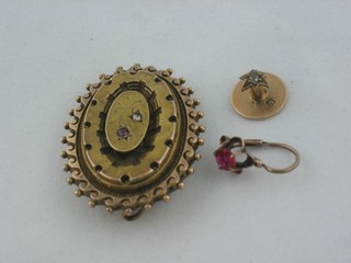 A Victorian oval gold brooch set a small diamond, a gold stud set a diamond and an ear clip