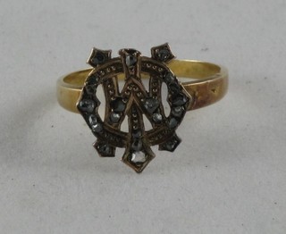 An 18ct gold dress ring with monogram and set small diamonds