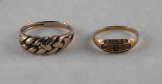 A gold keeper ring and 1 other