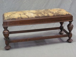 A rectangular oak stool with upholstered drop in seat, raised on bulbous turned supports 36"