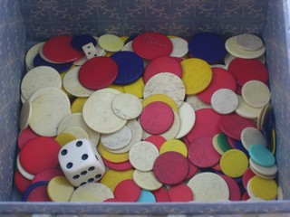 A collection of circular ivory gaming counters