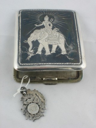 An Eastern cigarette case with Niello decoration and 2 silver watch chain medallions