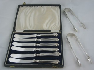 A pair of Victorian silver sugar tongs, a pair of silver do. and a set of 6 silver plated tea knives with silver handles