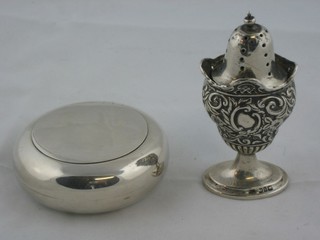 A circular silver tobacco box with hinged lid and a silver pepper 3 ozs