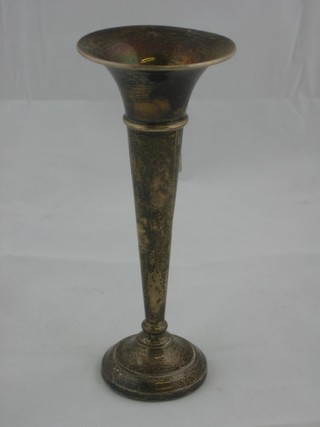 A trumpet shaped silver specimen vase raised on a spreading foot  6"