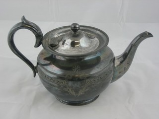 A circular Britannia metal teapot