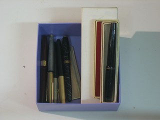A silver cased comb and a collection of fountain pens