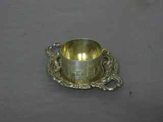 A circular silver twin handled dish 4" and a napkin ring