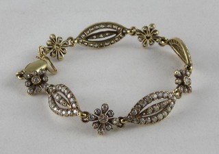A lady's attractive gold bracelet set numerous diamonds, approx 8ct