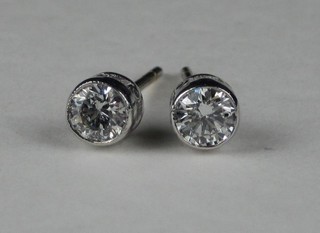 A pair of 18ct white gold ear studs set diamonds, approx 0.68ct