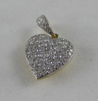 A very attractive 18ct yellow gold heart shaped pendant set numerous diamonds
