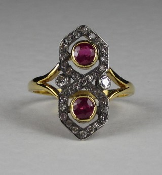 A lady's 18ct yellow gold Art Deco style dress ring set 2 rubies surrounded by diamonds