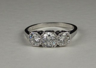 A lady's 18ct white gold dress/engagement ring set 3 diamonds