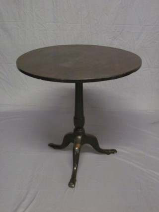 A handsome 19th Century circular mahogany snap top wine table, raised on pillar and tripod supports, the feet carved human feet 23"
