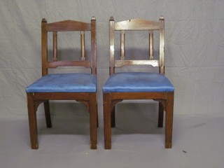 A pair of Victorian pine chapel chairs with upholstered seats