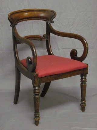 A Georgian mahogany bar back carver chair with shaped mid rail and upholstered seat, raised on turned supports