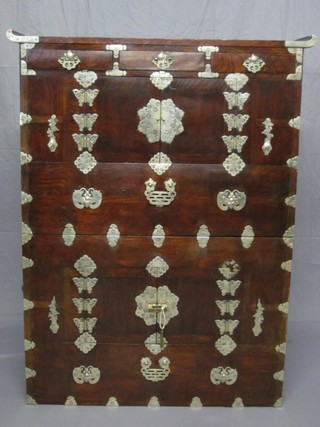 An Oriental hardwood cabinet on cabinet, fitted numerous drawers and cupboards with gilt metal mounts throughout, 38"