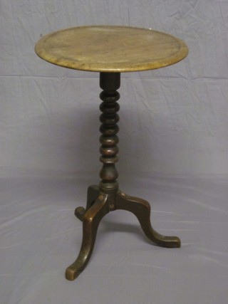 A Victorian bleached mahogany wine table, raised on a bobbin turned column and triform supports (restored) 18"
