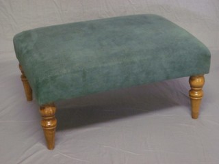 A Victorian rectangular oak stool upholstered in green material, raised on turned supports 28"