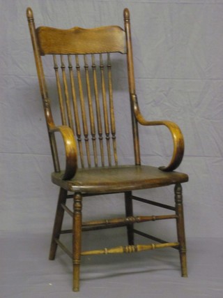 A 19th Century American style elm stick and bar back carver chair