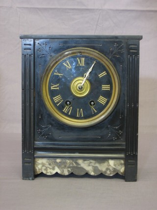 A Victorian French 8 day striking mantel clock contained in a black marble case and with Roman numerals