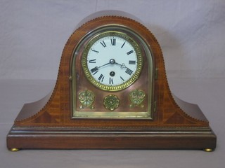 A 19th Century French mantel clock with enamelled dial and Arabic numerals with arch shaped brass dial, contained in an inlaid mahogany Admiral's hat shaped case